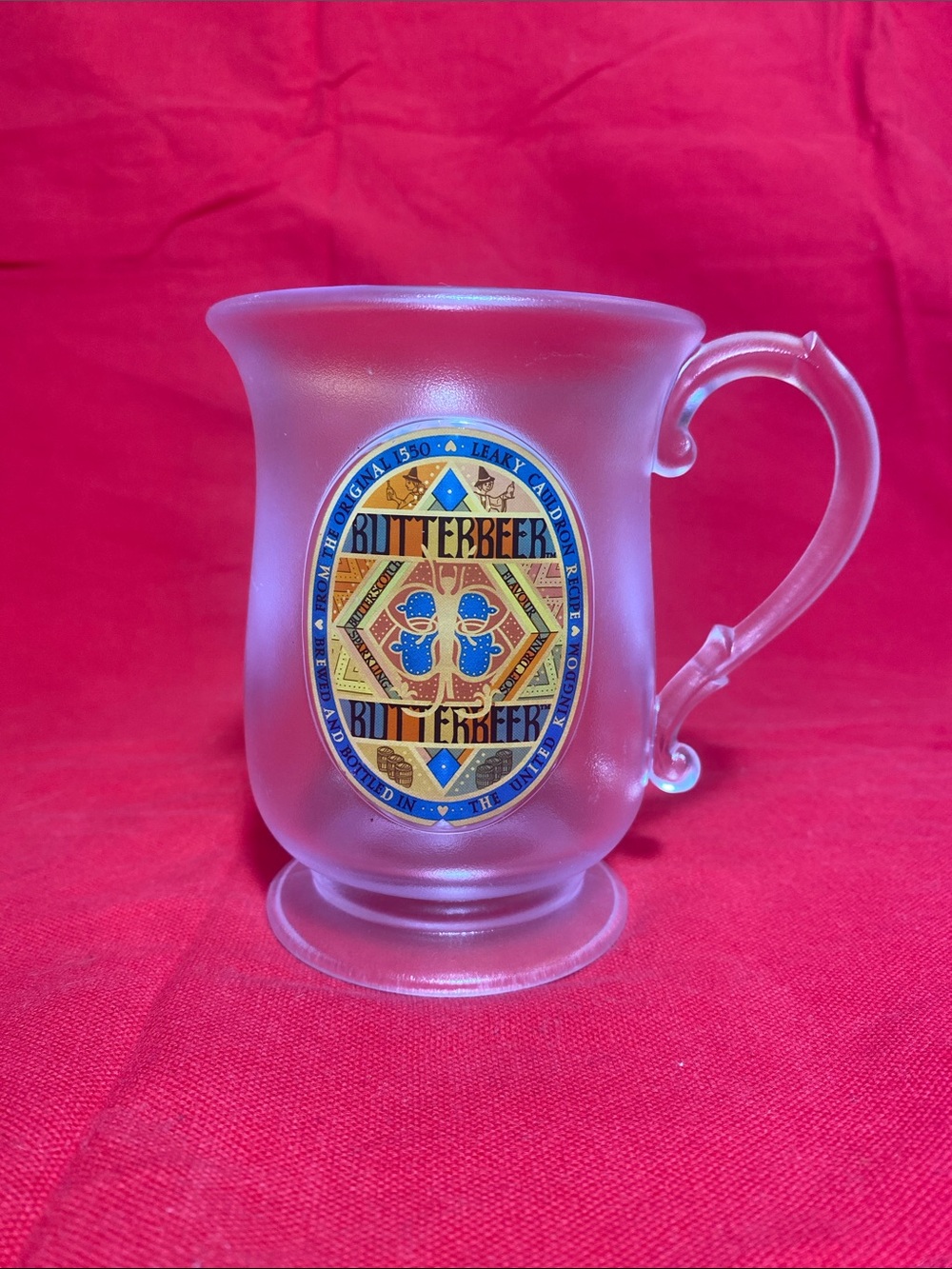 Harry Potter Wizarding World Frosted Plastic Butterbeer mug with curved handle